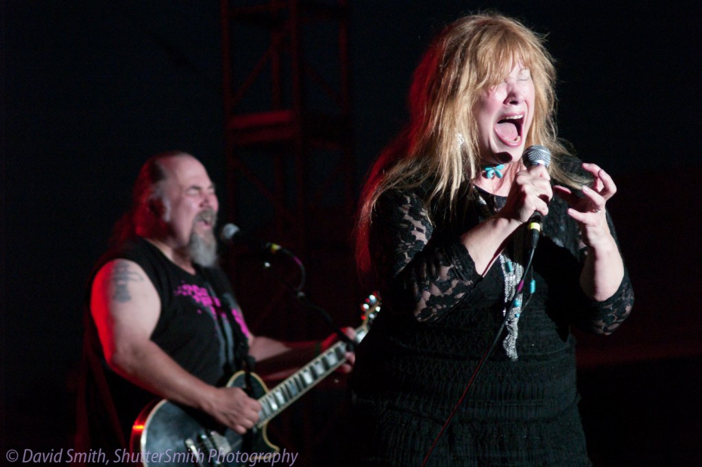 Wendy Kaiser of REZ band singing her heart out in a reunion concert in 2011.
